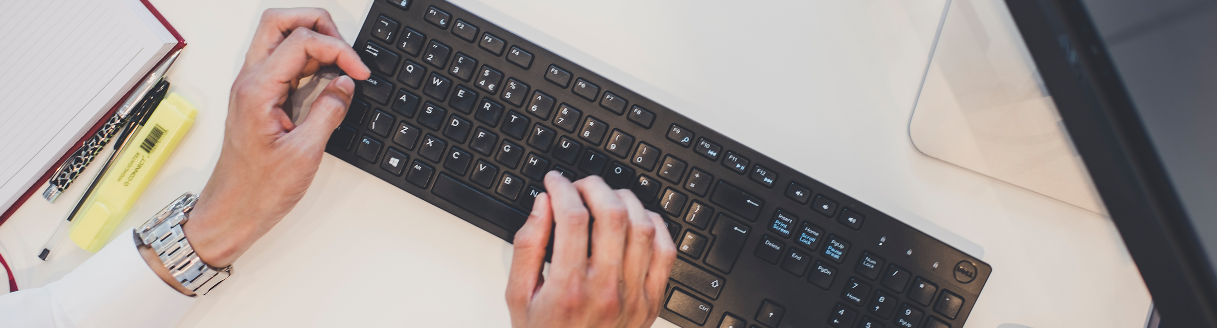 Stay safe online with the latest advice from Autotrader's fraud team Vehicles on a UK motorway styled with binary code running across the image to signify secure data