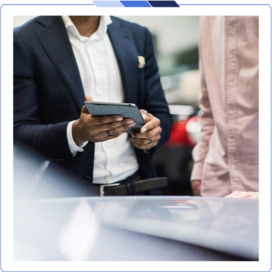 Part-Exchange Guide Sales manager showing a customer a part-exchange value