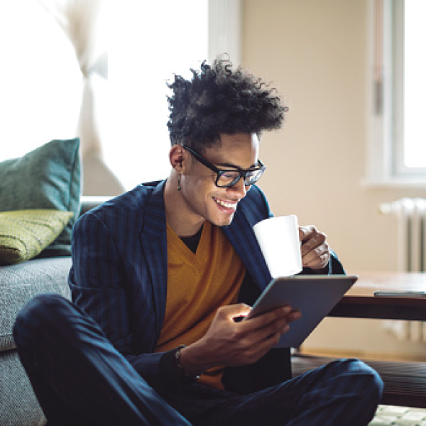 Market browsers spend more than X million minutes searching daily A consumer drinking a hot drink whilst browsing Autotrader via a digital device