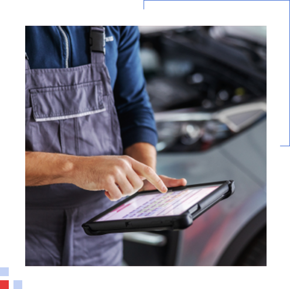 Vehicle Check A mechanic running a vehicle check on an iPad